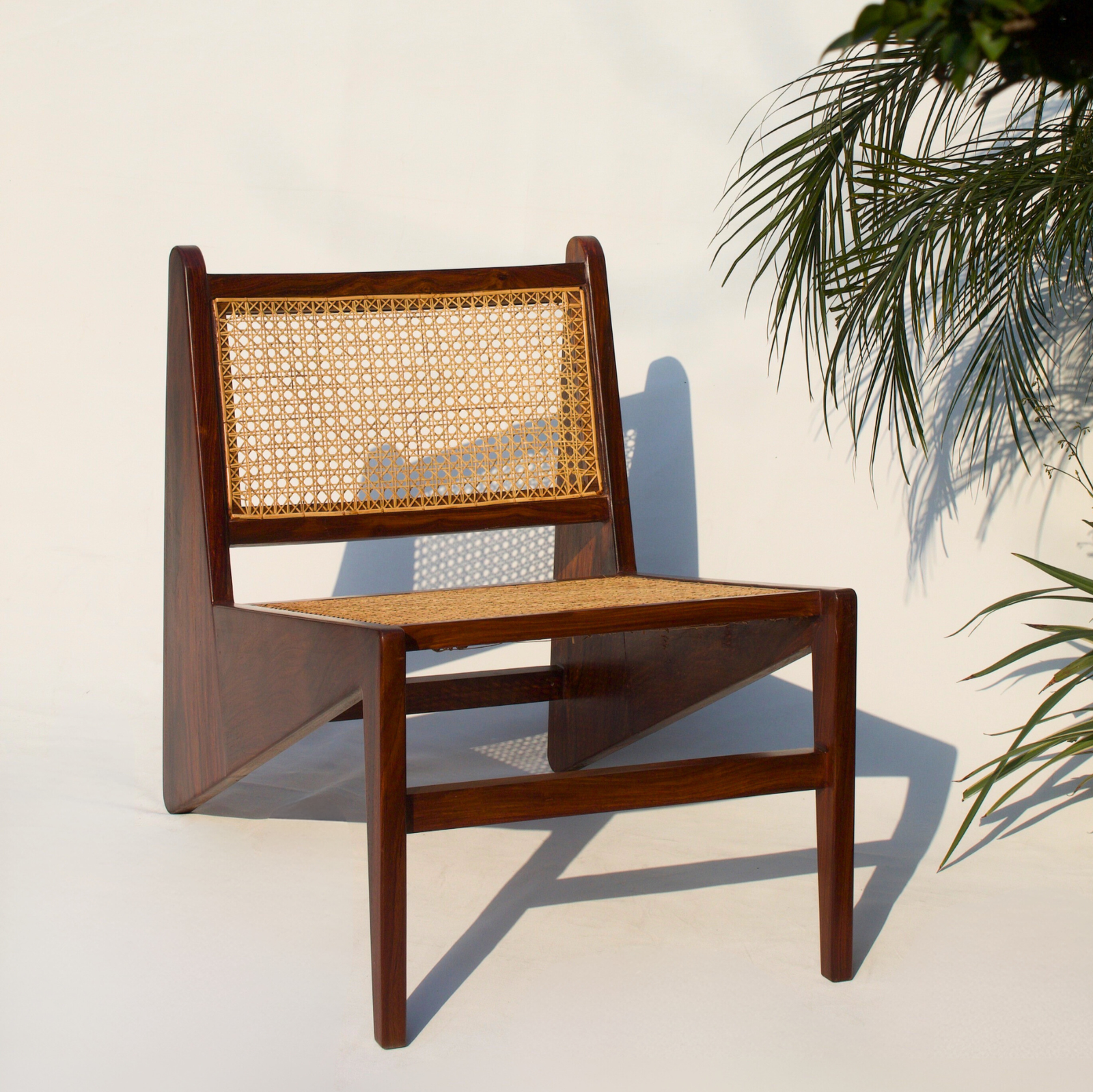Rosewood Cane Chair with a handcrafted rosewood frame and woven cane seat and backrest.