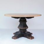 Gileteen Round Dining Table with solid wood construction and smooth round surface