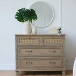 Gileteen Rattan Dresser – Wooden dresser with six drawers and natural rattan detailing.