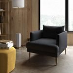 Kalmar Armchair with soft fabric upholstery, wooden frame, and deep cushioning