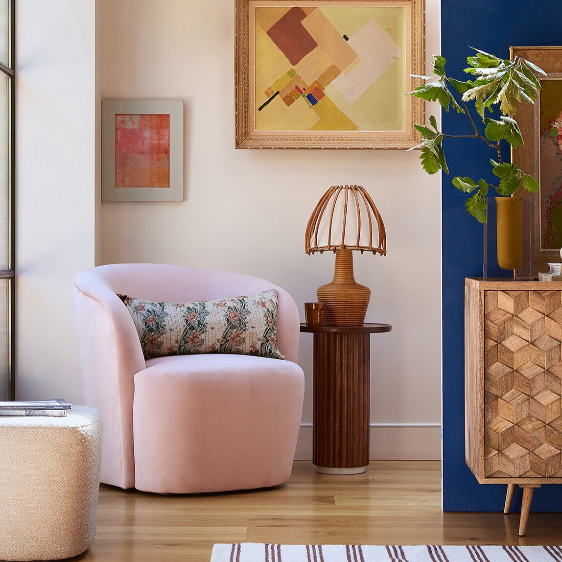 Ritz Occasional Chair with velvet upholstery, gold-finished legs, and a curved silhouette