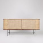 Moro Sideboard in dark brown acacia wood with natural rattan panels and matt black legs