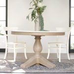 Gileteen Round Dining Table with solid wood construction and natural finish