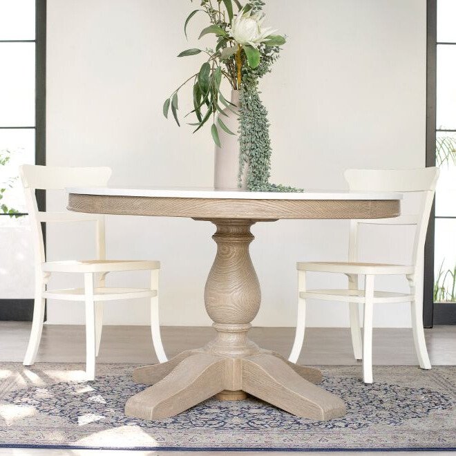 Gileteen Round Dining Table with solid wood construction and natural finish