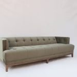 Gileteen Tufted Tuxedo Sofa with deep tufting and high arms.