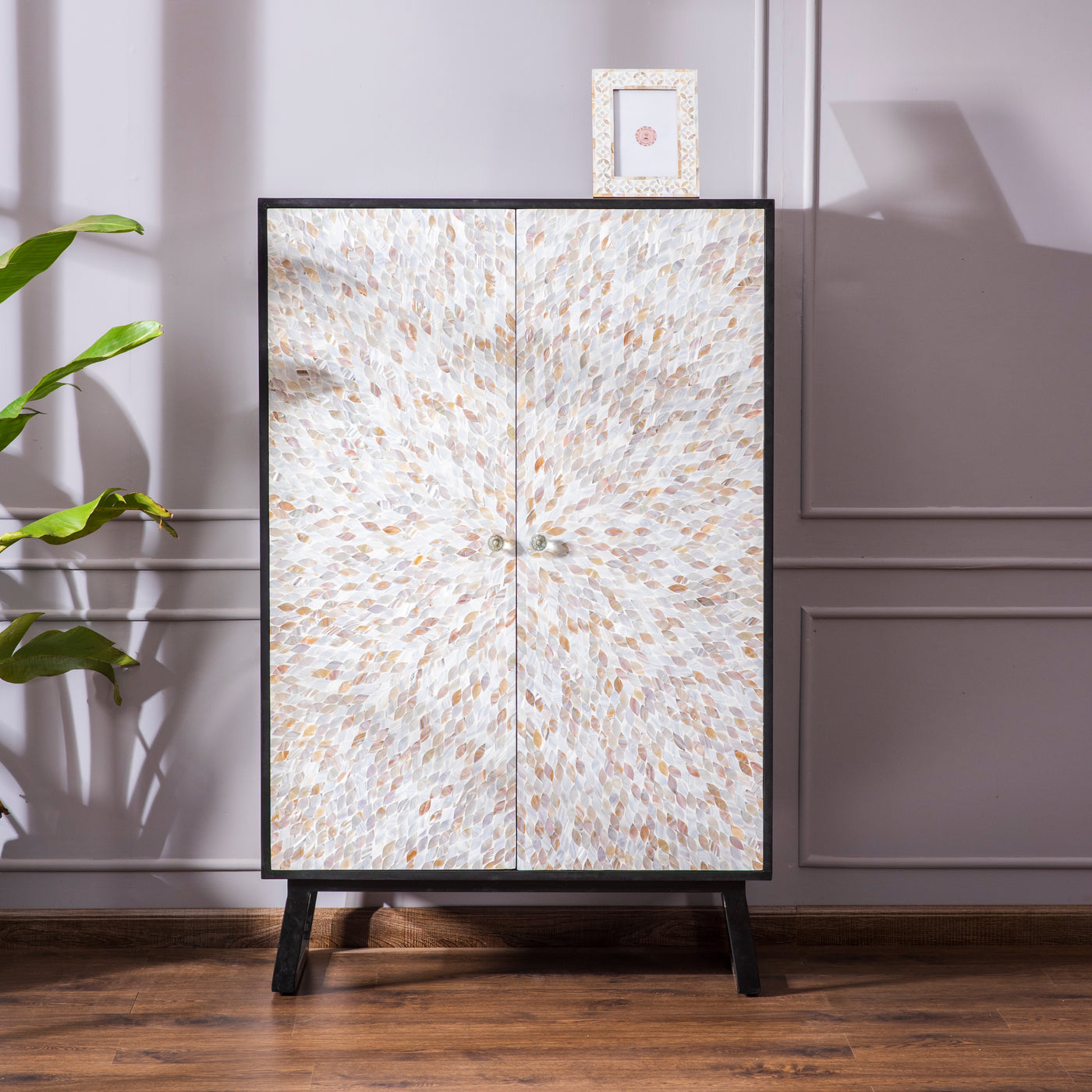 Bar cabinet with Mother of Pearl shatter flower pattern inlay on a Midnight Black finish.