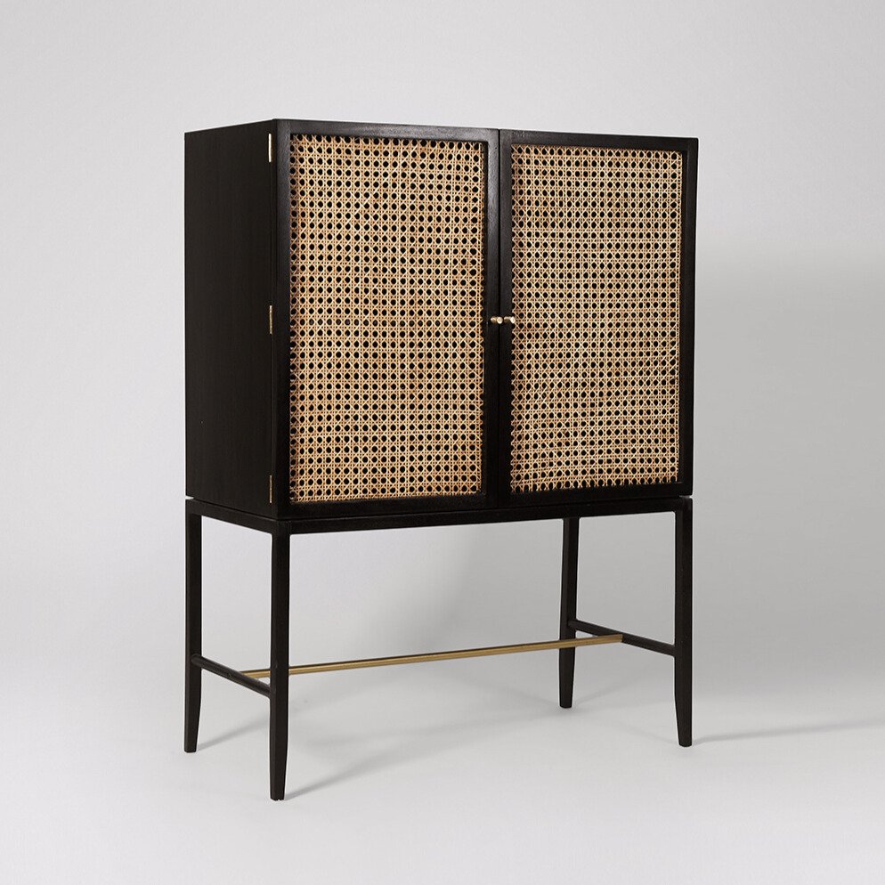 Raphia Drinks Cabinet – Black mango wood drinks cabinet with natural rattan panels and brass handles