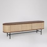 Moro TV Stand in dark brown acacia wood with natural rattan panels and matt black steel legs.​