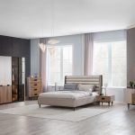 Katana Double Bed Frame in black mango wood with brass accents and a textured headboard