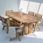 Madeline Oval Dining Table with natural wood top and unique slatted flat legs, ideal for modern dining rooms