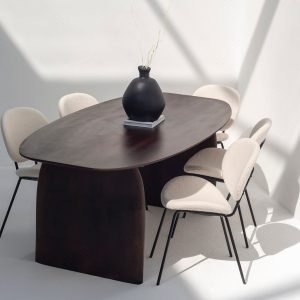 Galienne Oval Dining Table with a smooth solid wood surface and slender base, ideal for modern or transitional interiors
