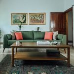 Kah Sofa 2.5 Seater – modern upholstered sofa with wooden legs in a cozy living space