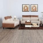 "Vanilla Sofa with beige fabric cushions and wooden base frame"