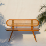 Solid wood bench with handwoven cane seat, ideal for home interiors.