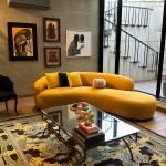 Aura Curve Sofa with flowing silhouette, plush cushioning, and luxury upholstery.