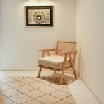 Scissor Chair – sculptural modern chair with crisscross wooden frame and cushioned seat