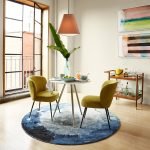 Koko Chair with soft curved silhouette and plush upholstery