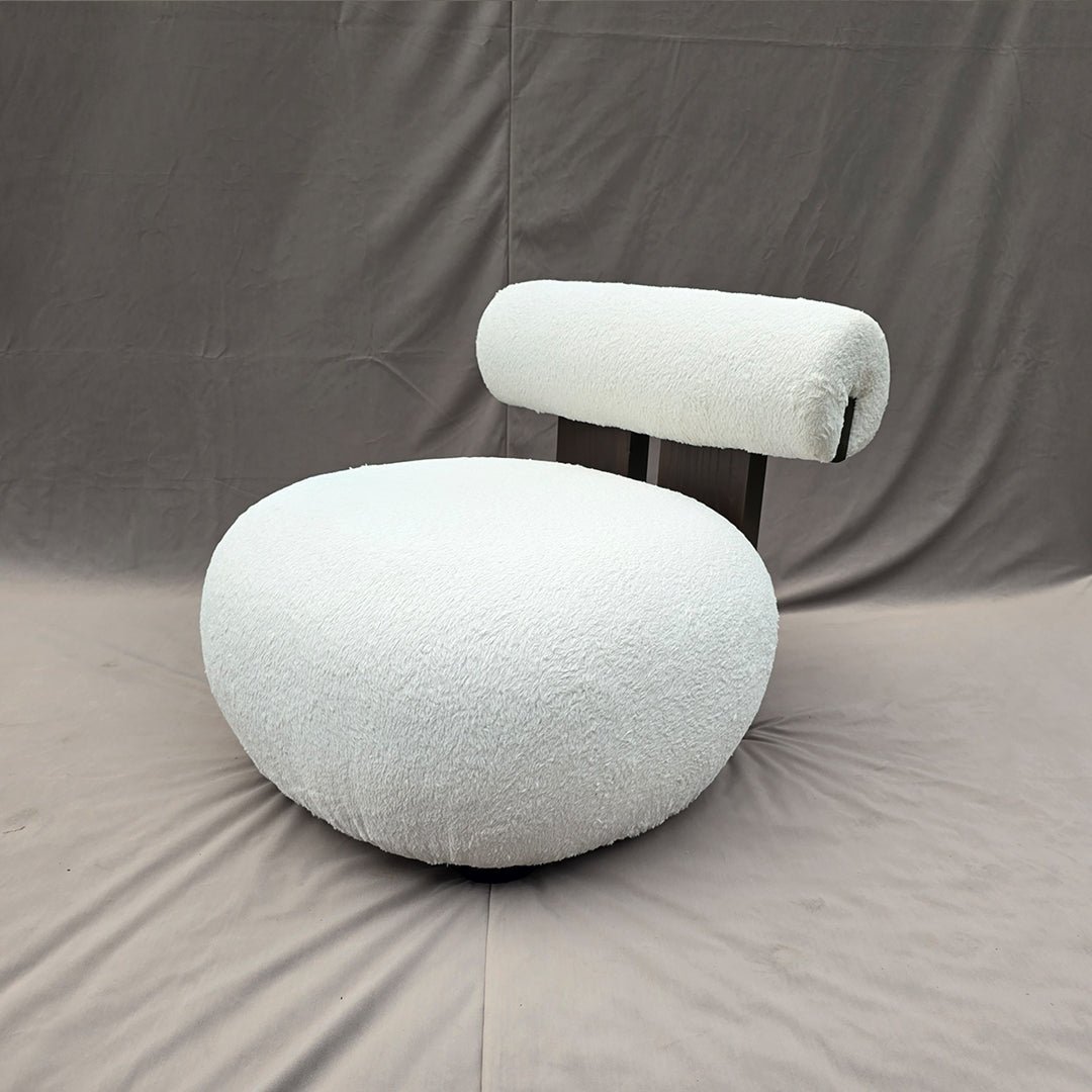 CloudRoll Lounge Chair with plush boucle upholstery, featuring a sculptural, cloud-like silhouette in a modern living room.