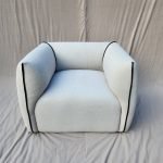 "Genesis solid wood chair with curved backrest and natural finish"