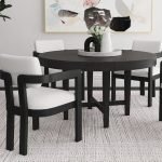 Contemporary round dining table with sculptural cross pedestal base in wood
