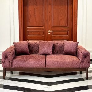 Chesterfield Sofa showcasing deep button tufting and rolled arms in a classic living room setting.