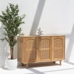 Hans 3 Doors Rattan Sideboard featuring a solid wood frame, handwoven rattan doors, and spacious storage compartments.