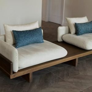 Platform Sofa by Neri & Hu featuring integrated side tables and luxurious upholstery in a contemporary living room setting.