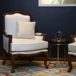 Classic French Louis XV Style Armchair with carved wooden frame and upholstered seat