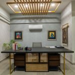 Retro desk with wood and metal construction, featuring clean lines and a spacious work surface in a stylish modern office setting