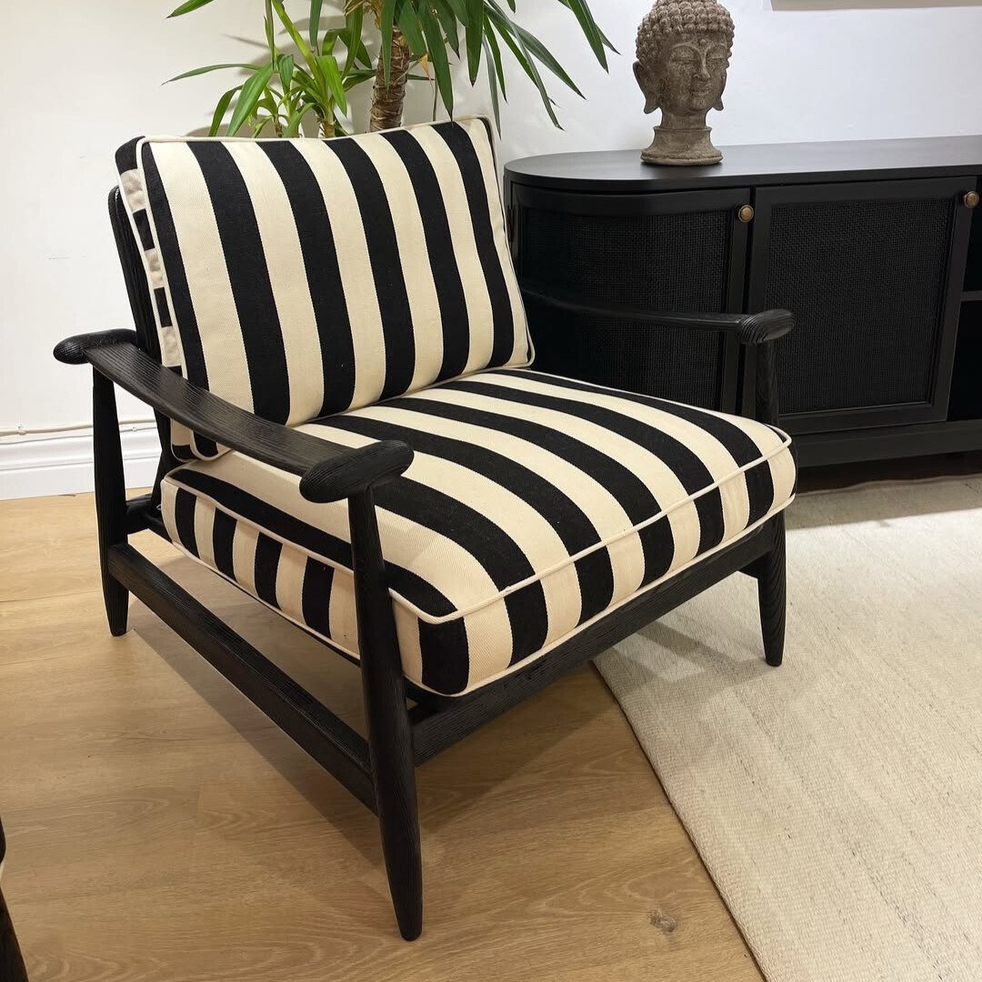 Modern Solo Sofa Chair with vintage detailing and solid wood frame in a cozy interior