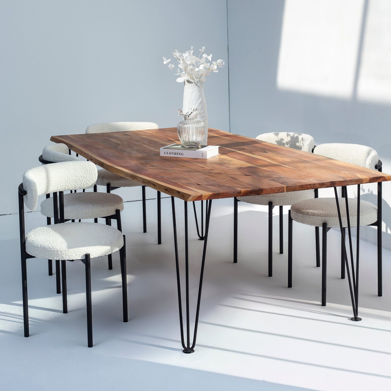 Solid dark acacia wood dining table with rich grain and minimalist design