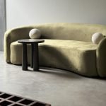The Jelly Bean Sofa in velvet upholstery with curved modern design