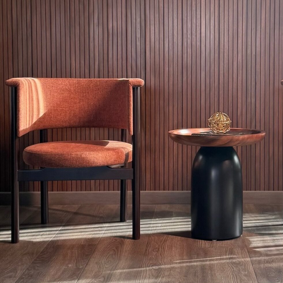 Sunset Arc Chair with arched backrest and upholstered seat in a modern living space