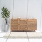 Tori Rattan Wood Sideboard featuring a solid wood frame, handwoven rattan doors, and spacious storage compartments.