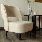 Void Chair with sculptural cutout design and monolithic form in a minimalist interior