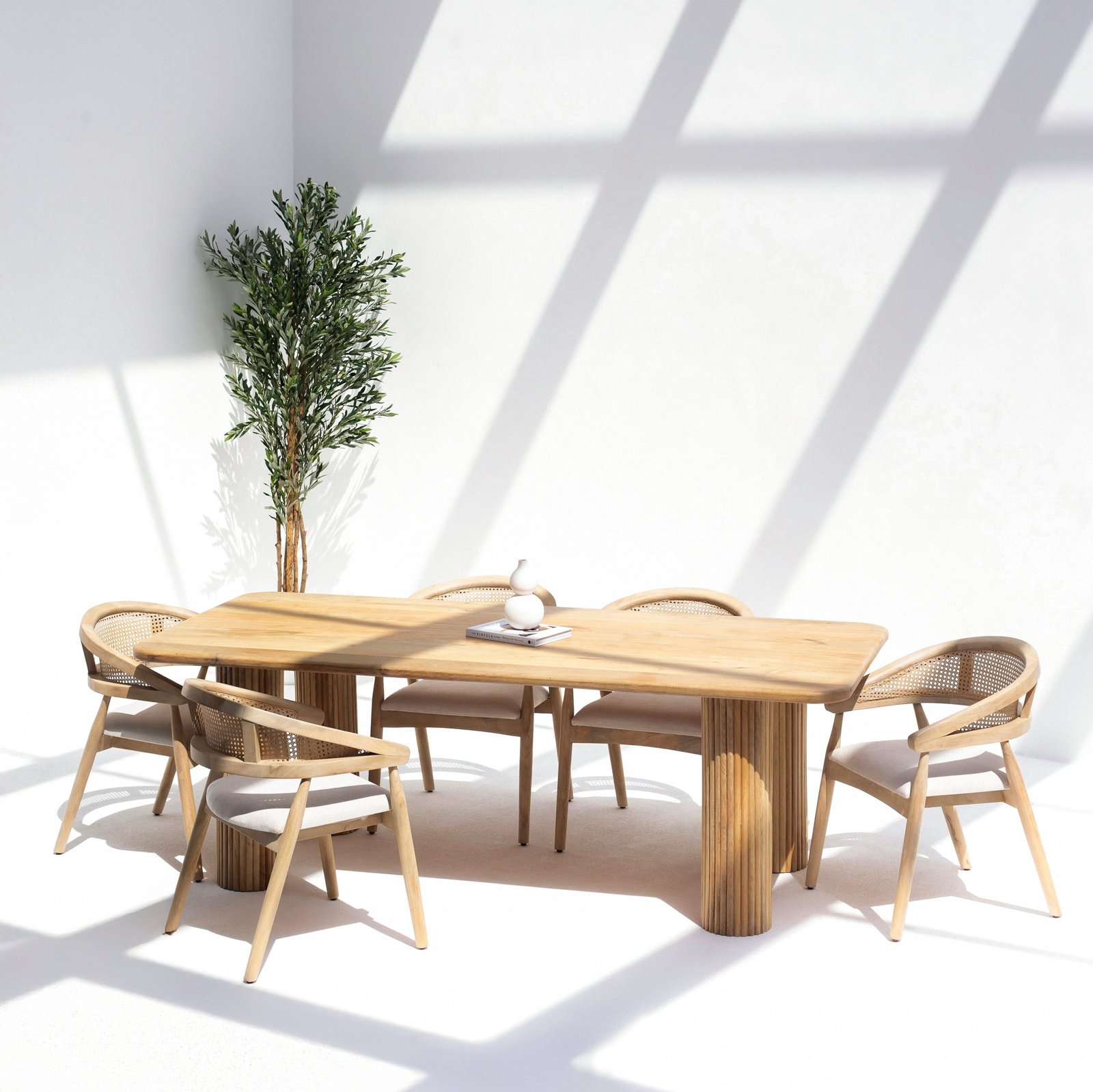 Umbria Dining Table made of solid mango wood with block-style legs and natural finish