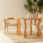 Hendel Wooden Dining Table with a natural wood finish and spacious surface