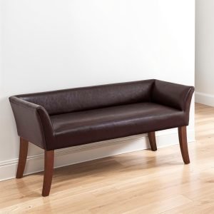 Upholstered bed bench with arms, wooden frame, and elegant padded seating.