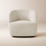 Grevy Swivel Chair – rounded modern swivel chair with soft fabric and sculptural silhouette