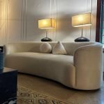 Cream Curved Sofa – modern sculptural couch with plush upholstery