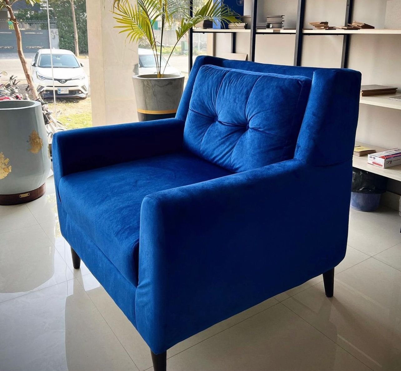 Blue Pop Out Sofa – bold modern sofa with curved design and blue velvet upholstery
