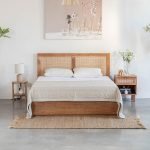 Contemporary Acacia wood bed with clean lines and warm finish in a modern bedroom