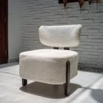 Sheep Chair – plush white faux shearling chair with rounded form and wooden legs