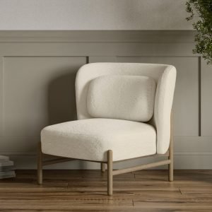Nora Chair featuring a minimalist oak frame and upholstered seat, set in a Scandinavian-style interior.
