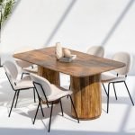 Emory Long Wooden Dining Table with solid rectangular top and sculptural round legs in a minimalist dining setting