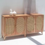 Naevia Rattan Doors Acacia Wood Sideboard with handwoven rattan detailing and a solid wood frame, featuring four storage compartments.