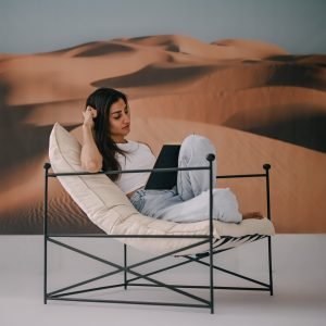 Eclipse Lounge Chair with sculptural wooden frame and curved armrests