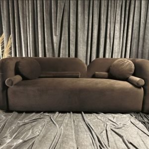 Cocoa Scandic Sofa with cocoa-colored upholstery and natural wood legs in a Scandinavian-style living room