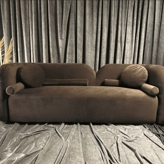 Cocoa Scandic Sofa with cocoa-colored upholstery and natural wood legs in a Scandinavian-style living room