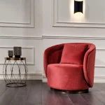 CozyCradle Arm Chair in caramel velvet with rounded arms and deep cushions in a cozy living room setting